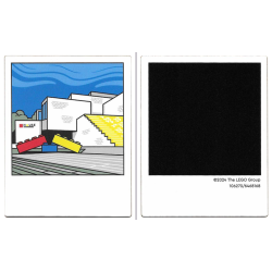 Plastic Polaroid Photo with White LEGO House Building with Red, Yellow, and Blue Bricks and Black Square on Back Pattern