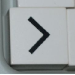 Duplo, Tile 2 x 2 x 1 with Black Less Than Sign (<) / Greater Than Sign (>) Pattern Duplo, Tile 2 x 2 x 1 with Black Less Than Sign (<) / Greater Than Sign (>) Pattern