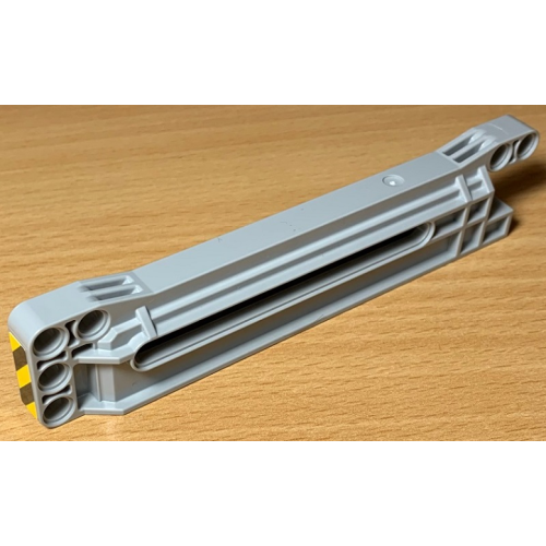 Деталь LEGO 18940pb01b Technic, Gear Rack 1 x 14 x 2 Housing with Black and Yellow Danger Stripes Pattern Rear Side (Sticker) - Set 42078