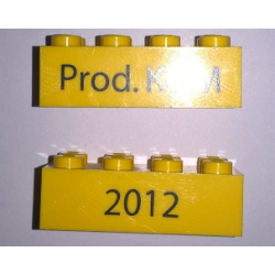 Brick 2 x 4 with Black '2012' and 'Prod. KOM' Pattern on Opposite Sides (Kornmarken Factory Tour) - Yellow Brick 2 x 4 with Black '2012' and 'Prod. KOM' Pattern on Opposite Sides (Kornmarken Factory Tour) - Yellow