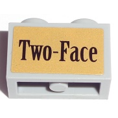 Деталь LEGO 32064pb02 Technic, Brick 1 x 2 with Axle Hole with Black 'Two-Face' on Gold Background Pattern (Sticker) - Set 7785