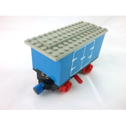 Train Battery Box Car with Two Contact Holes, Red Switch Lever, Blue and Red Magnets, Red Wheels, and Light Gray Roof with Hinged Doors Pattern on Both Sides (Stickers) - Set 7720