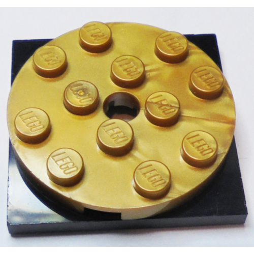 Деталь LEGO 60474c01 Turntable 4 x 4 x 2/3 with Black Square Base, Free-Spinning (60474 / 61485) - Pearl Gold